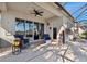 Relaxing covered patio with seating, overlooking the pool area at 15707 Crystal Waters Dr, Wimauma, FL 33598