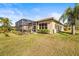 House exterior with backyard and screened porch at 15767 Crystal Waters Dr, Wimauma, FL 33598