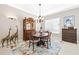 Elegant dining room with wooden table and decorative accents at 15767 Crystal Waters Dr, Wimauma, FL 33598