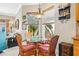 Charming kitchen nook with a glass-top table and wicker chairs at 15767 Crystal Waters Dr, Wimauma, FL 33598