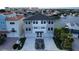 Modern three-story home with waterfront access and two-car garage at 160 174Th Terrace E Dr # B, Redington Shores, FL 33708