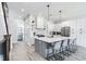 Modern kitchen with large island and stainless steel appliances at 160 174Th Terrace E Dr # B, Redington Shores, FL 33708