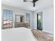 Main bedroom with private balcony access and city views at 160 174Th Terrace E Dr # B, Redington Shores, FL 33708