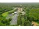 Aerial view of tennis courts and clubhouse at 16104 Stowe Ct, Tampa, FL 33647