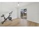 Room with sliding door to backyard and Peloton exercise bike at 16104 Stowe Ct, Tampa, FL 33647