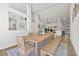 Modern dining room with light hardwood floors and a large window at 16104 Stowe Ct, Tampa, FL 33647