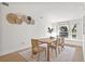 Light-filled dining area with wooden table and window seat at 16104 Stowe Ct, Tampa, FL 33647