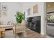 Modern fireplace with dark stone surround and light living room at 16104 Stowe Ct, Tampa, FL 33647