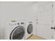 Laundry room with washer, dryer, and additional storage at 16104 Stowe Ct, Tampa, FL 33647