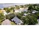 Aerial view showing a charming blue house with a gray roof, nestled in a quiet neighborhood at 1815 2Nd E Ave, Bradenton, FL 34208