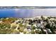 Wide aerial view showcasing a home's waterfront proximity and neighborhood setting at 1815 2Nd E Ave, Bradenton, FL 34208