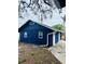 Side view of the detached garage, showing its blue exterior at 1815 2Nd E Ave, Bradenton, FL 34208