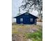 Blue detached garage with two doors, offering additional storage at 1815 2Nd E Ave, Bradenton, FL 34208