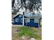 Rear view of the house, showing its blue paint and backyard at 1815 2Nd E Ave, Bradenton, FL 34208