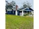 Front yard view of the charming blue house at 1815 2Nd E Ave, Bradenton, FL 34208