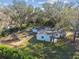 Aerial view of a house with large backyard near lake at 18803 15Th St, Lutz, FL 33549