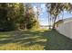 Large grassy backyard with lake view and privacy at 18803 15Th St, Lutz, FL 33549