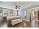 Main bedroom with hardwood floors and ceiling fan at 18803 15Th St, Lutz, FL 33549