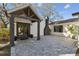 Inviting entryway with gray pavers and a modern gray and white exterior at 18803 15Th St, Lutz, FL 33549