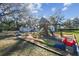 playground with slide, swings, and playhouse at 18803 15Th St, Lutz, FL 33549