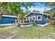 Blue house with a deck and detached shed at 207 E Selma Ave, Tampa, FL 33603