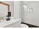 Modern bathroom with white vanity, hexagon tile floor and marble shower at 207 E Selma Ave, Tampa, FL 33603