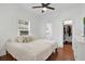 Bright bedroom with a king-size bed, large closet and hardwood floors at 207 E Selma Ave, Tampa, FL 33603