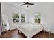 Charming bedroom with hardwood floors, large windows, and ceiling fan at 207 E Selma Ave, Tampa, FL 33603