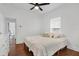 Spacious bedroom with hardwood floors, ceiling fan, and ample closet space at 207 E Selma Ave, Tampa, FL 33603