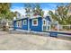 Side view of a charming blue house at 207 E Selma Ave, Tampa, FL 33603