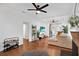 Bright living room with hardwood floors, sectional sofa, and fireplace at 207 E Selma Ave, Tampa, FL 33603