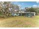 Charming home with fenced pool, mature trees, and expansive backyard at 3009 Jim Johnson Rd, Plant City, FL 33566