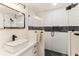 Modern bathroom with white subway tile, a frameless glass shower, and a floating vanity at 3009 Jim Johnson Rd, Plant City, FL 33566