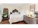 Guest bedroom with unique headboard and vintage dresser at 3009 Jim Johnson Rd, Plant City, FL 33566