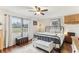 Spacious bedroom with a metal bed frame and large windows at 3009 Jim Johnson Rd, Plant City, FL 33566