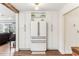 Modern kitchen featuring white cabinets, stainless steel appliances, and stylish lighting, creating a clean and functional space at 3009 Jim Johnson Rd, Plant City, FL 33566