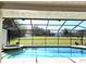 Inviting pool and spa area with screened enclosure and open backyard at 3009 Jim Johnson Rd, Plant City, FL 33566