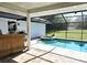 Relaxing pool and spa with wooden bar and spacious patio at 3009 Jim Johnson Rd, Plant City, FL 33566