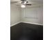 Spacious bedroom with dark hardwood floors and a ceiling fan at 306 S Habana Ave # 7, Tampa, FL 33609