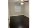 Bedroom with dark hardwood floors and a ceiling fan at 306 S Habana Ave # 7, Tampa, FL 33609