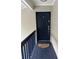 Condo building entryway with dark blue door and floral mat at 306 S Habana Ave # 7, Tampa, FL 33609