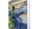 Exterior blue staircase leading to condo entrance at 306 S Habana Ave # 7, Tampa, FL 33609