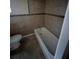 Bathroom with tub, toilet and tile flooring at 3504 E 22Nd Ave, Tampa, FL 33605