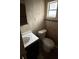 Clean bathroom with toilet, sink, and shower at 3504 E 22Nd Ave, Tampa, FL 33605