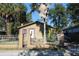 Tan house with white fence and palm tree in front yard at 3504 E 22Nd Ave, Tampa, FL 33605