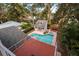 Aerial view showcasing a pool, patio, and detached guest house at 407 Bay View St, Safety Harbor, FL 34695