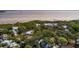 Aerial view of a house nestled in a tree-lined neighborhood near the water at 407 Bay View St, Safety Harbor, FL 34695