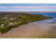 Aerial view of waterfront property with a home and private dock at 407 Bay View St, Safety Harbor, FL 34695