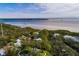 Aerial view showcasing a waterfront home and neighborhood at 407 Bay View St, Safety Harbor, FL 34695