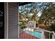 Balcony overlooking a swimming pool and backyard at 407 Bay View St, Safety Harbor, FL 34695